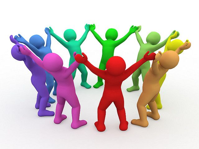 Stylized human figures in multiple colors in a circle holding hands and looking up at the sky