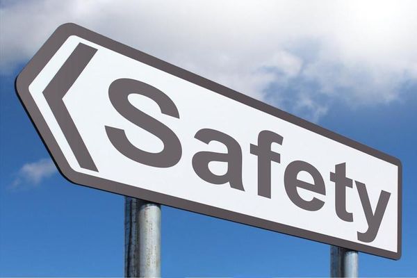 A road sign in the shape of an arrow with the word Safety